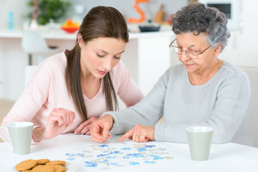 elderly person working on puzzle